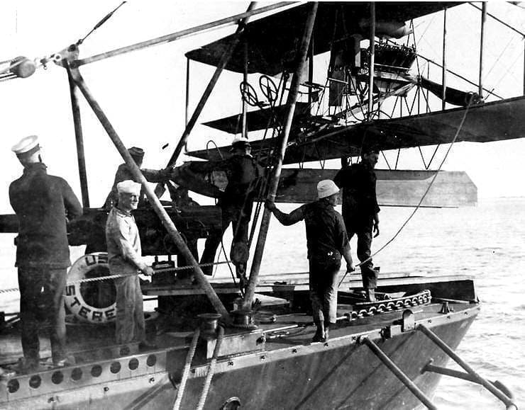 1915 Sterett sailors secure an AH-12 type seaplane on hoist aboard DD-27